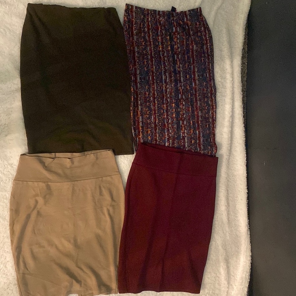 Four skirts. Multi color skirt is very stretchy only worn once size s/m.